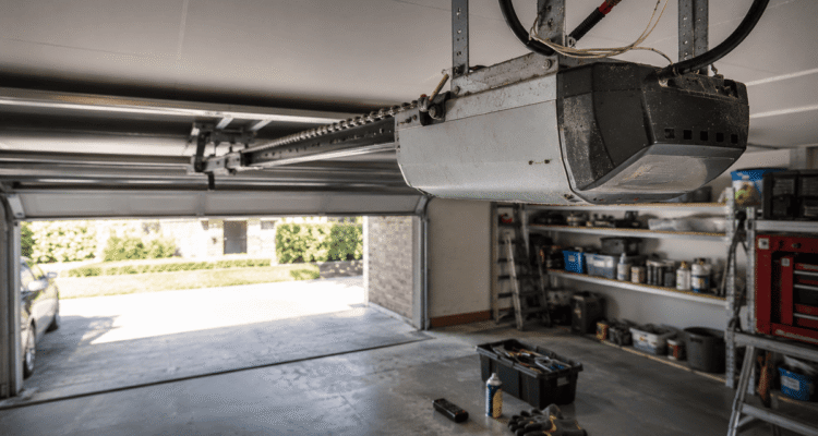 Worn garage door motor in an Australian garage showing dust, loose chain, and early signs of failure.